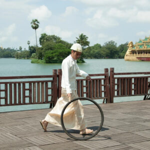 Moe Satt, 'The Bicycle Tyre Rolling Event From Yangon', 2013, photograph, 60.96 x 91.44 cm. Image courtesy of Nova Contemporary
