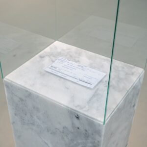 Wantanee Siripattananuntakul, 'The Reckoning', 2018, draft cheque on marble case, size variable. Image from Gallery VER